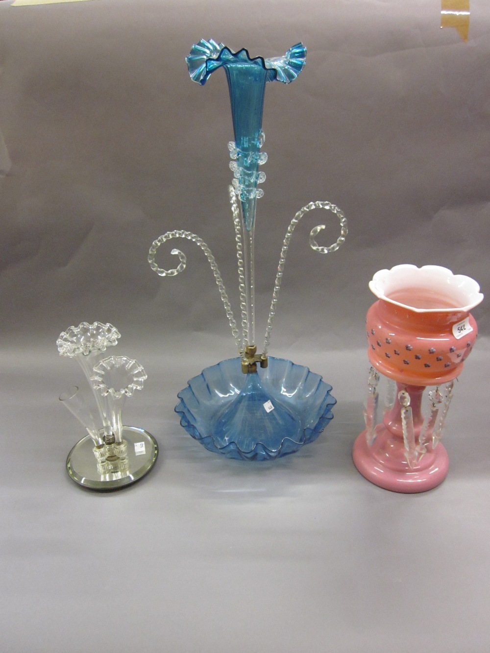 Clear glass three stem epergne with frilled edges and mirrored base together with a Victorian pink