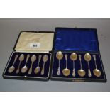 Cased set of six silver coffee spoons with shell pattern handles,