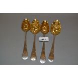 Pair of antique silver Old English pattern berry spoons with embossed gilded fruit decorated bowls