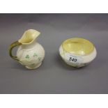 Belleek cream jug with matching sugar bowl having clover leaf decoration and green stamp