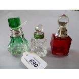 Green / clear glass perfume bottle with matching green stopper and white metal mount,