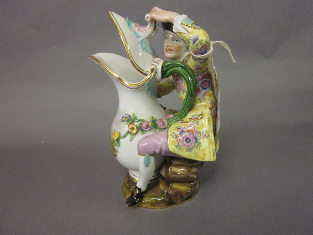 Similar 19th Century Meissen type figure seated beside a ewer,