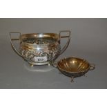 Birmingham silver embossed two handled sugar bowl and a small silver two handled bonbon dish on paw