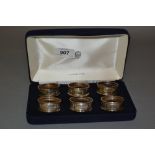 Cased set of six London silver napkin rings