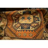 Turkish rug having two medallions on a rust ground with multiple borders, 5.5ft x 4.