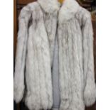 Ladies pale fox fur jacket by Saga, together with a similar mid brown fur jacket,