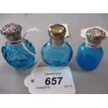 Turquoise cut circular perfume bottle with ornate white metal top, 4.