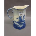 Large Anglo Delft blue and white jug decorated with a windmill