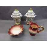 Pair of large triangular pedestal floral decorated vases with covers,