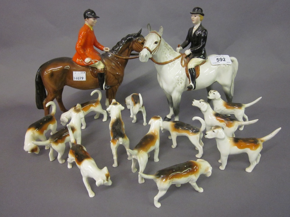 Beswick group of male and female hunters on horseback with twelve Beswick hounds