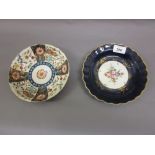 Worcester Dr Wall period saucer dish, painted with panels of flowers in iron red, blue and gilt,