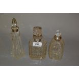 Three silver mounted cut glass perfume bottles