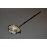 Antique white metal toddy ladle inset with a George II coin with a twisted whale bone handle