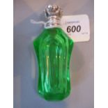 Victorian green cut glass waisted perfume bottle with ornate hinged white metal top and stopper,