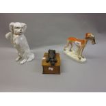 19th Century Staffordshire pottery figure of a greyhound together with a Continental bisque figure
