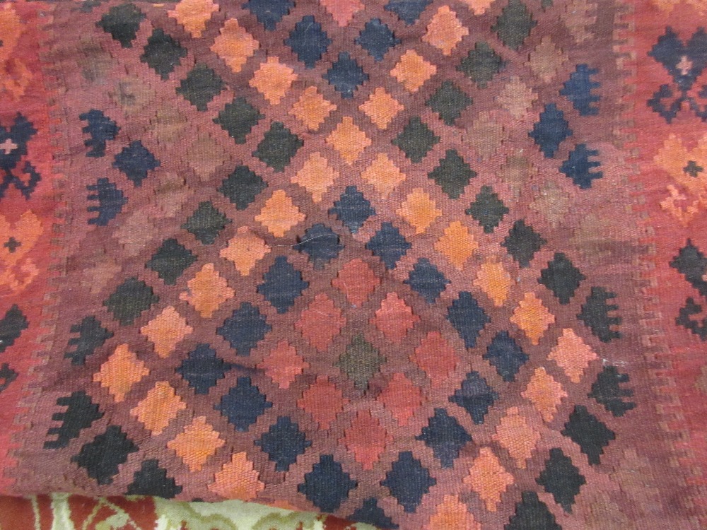 Karaja rug having a row of three hooked medallions and multiple borders on a rust and blue ground, - Image 2 of 2