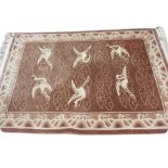 Large Chinese carpet with embossed design in shades of mid and light brown,