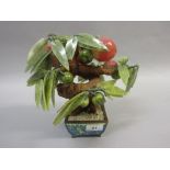 Oriental carved hardstone miniature model of a tree bearing fruit in a floral enamel pot,