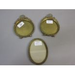 Pair of late 19th or early 20th Century miniature gilt brass circular photo frames with wreath and