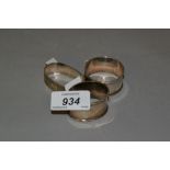 Three various silver napkin rings