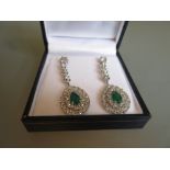 Pair of 18ct white gold pear drop emerald and diamond cluster drop earrings