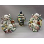 Pair of large 20th Century Chinese figures of seated Buddha with children together with a baluster