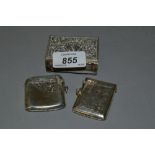 Two floral engraved silver vesta cases and an embossed silver match box holder