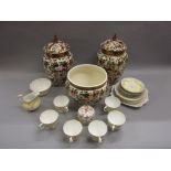 Pair of floral decorated pottery vases with covers and a matching jardinere together with a Royal