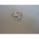 18ct White gold diamond solitaire ring with diamond set shoulders