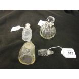 Unusual Art Deco clear and moulded glass perfume bottle with sterling silver mount and matching