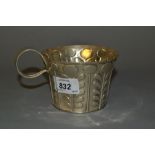 Arts and Crafts Chester silver mug with embossed stylised floral decoration and loop handle