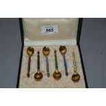 Set of six Norwegian silver gilt enamel decorated coffee spoons,