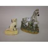 Small 19th Century Staffordshire figure of a zebra together with another of a seated spaniel