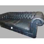 Blue buttoned leather upholstered three seater Chesterfield sofa bed