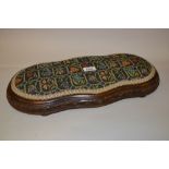 Low late 19th / early 20th Century shaped and carved floral upholstered kneeling stool,