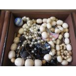 Brown jewellery box containing a small quantity of costume jewellery