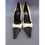 Pair of cream leather ladies Chanel shoes with black toes and heels,