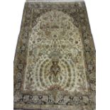 Indo Persian cotton silk style rug with a vase and tree of life design on a beige ground with