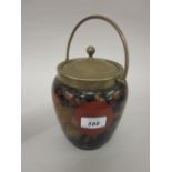 Moorcroft biscuit barrel with silver plated mounts decorated with the pomegranate and grape design,