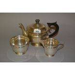 Sheffield silver circular three piece teaset with ebony handles