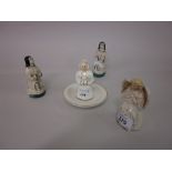 Pair of 19th Century pottery kneeling figure candle snuffers together with a nun candle snuffer and