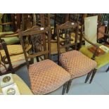 Pair of Edwardian carved walnut pierced splat back side chairs