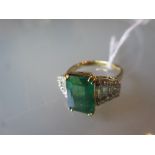 18ct Emerald and diamond cluster ring, the emerald approximately 3.
