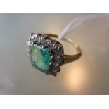 Early 20th Century yellow gold emerald and diamond rectangular cluster ring