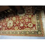 Group of three various Indo Persian rugs with stylised floral design on a beige and red ground with
