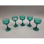 Set of five 19th Century green tinted and faceted drinking glasses