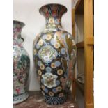 Large Imari baluster form vase decorated with exotic birds in landscapes, in iron red, blue,