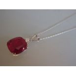 Large 18ct white gold pendant set treated cushion cut ruby on an 18ct white gold chain
