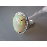 18ct White gold opal and diamond cluster ring, the pear shaped opal approximately 10.