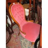 Pink button upholstered low seat nursing chair in Victorian style